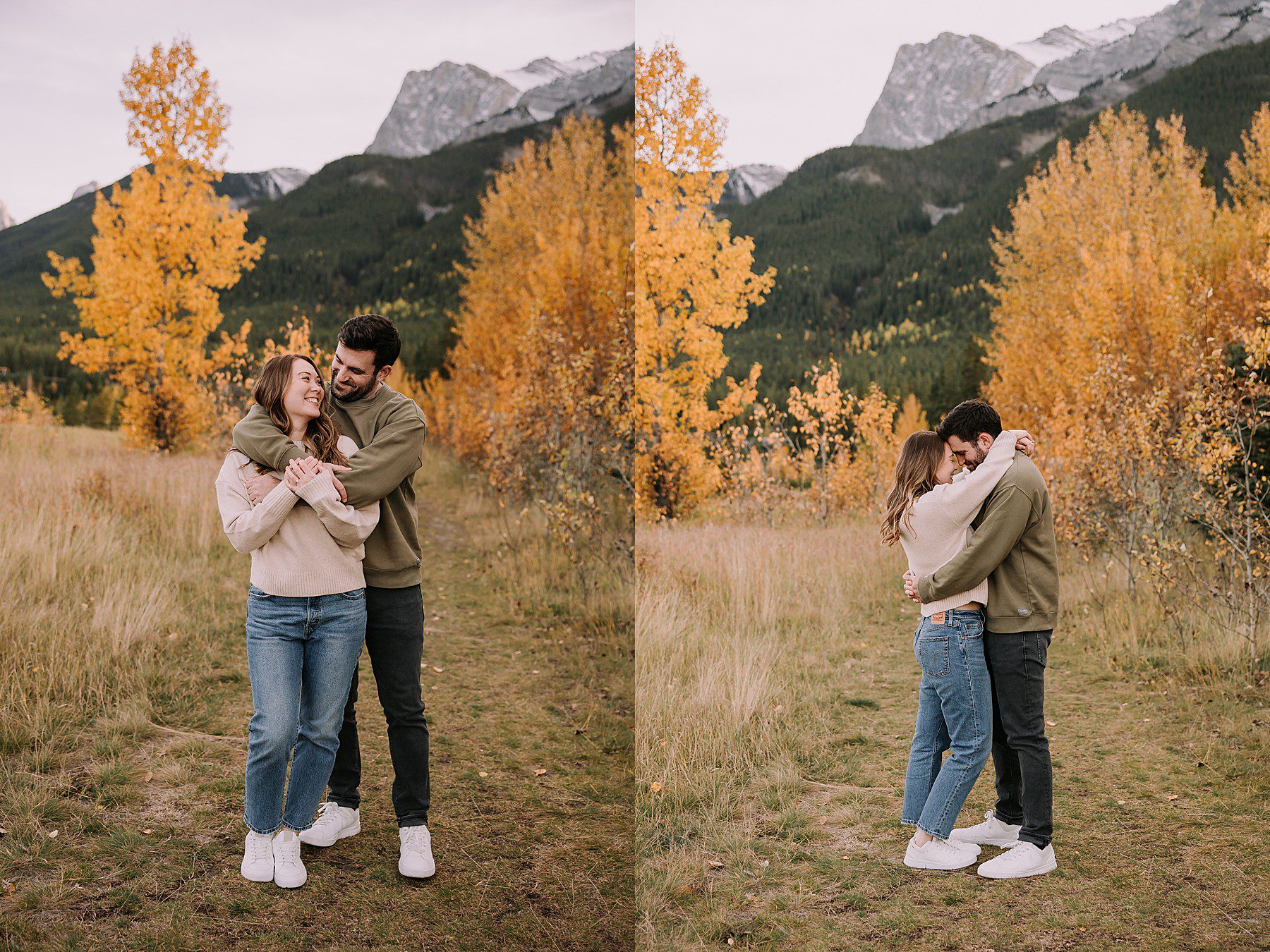 couple standing and snuggling in front of fall colored trees and mountains