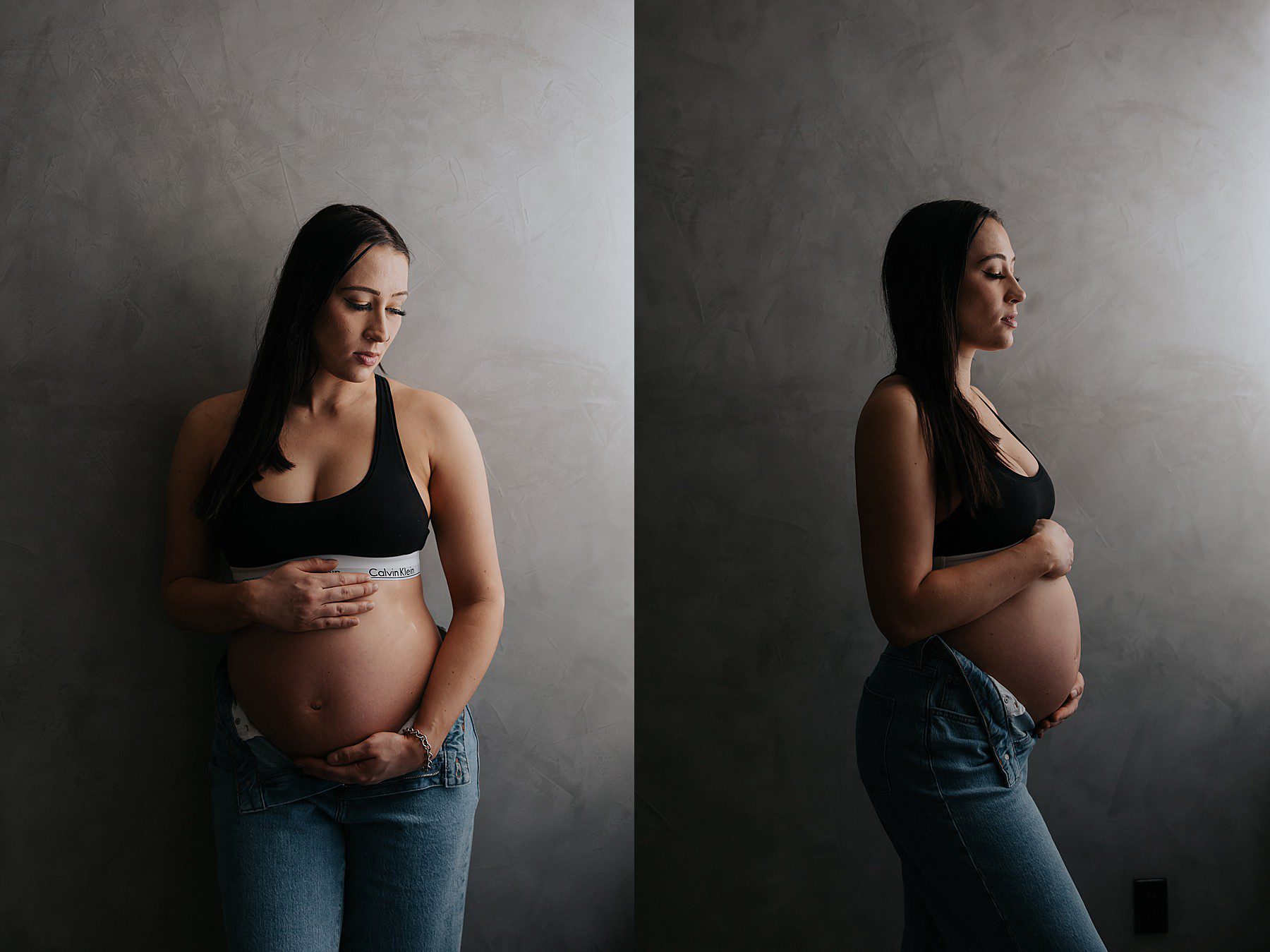 woman posing in a studio for maternity photos. She is wearing jeans with the top button undone and a black calvin klein bra
