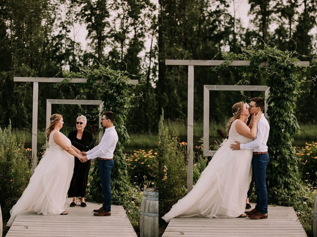 women dressed in a wedding dress and man dressed in dress pants and white shirt. They are standing at the wedding alter surrounded by nature