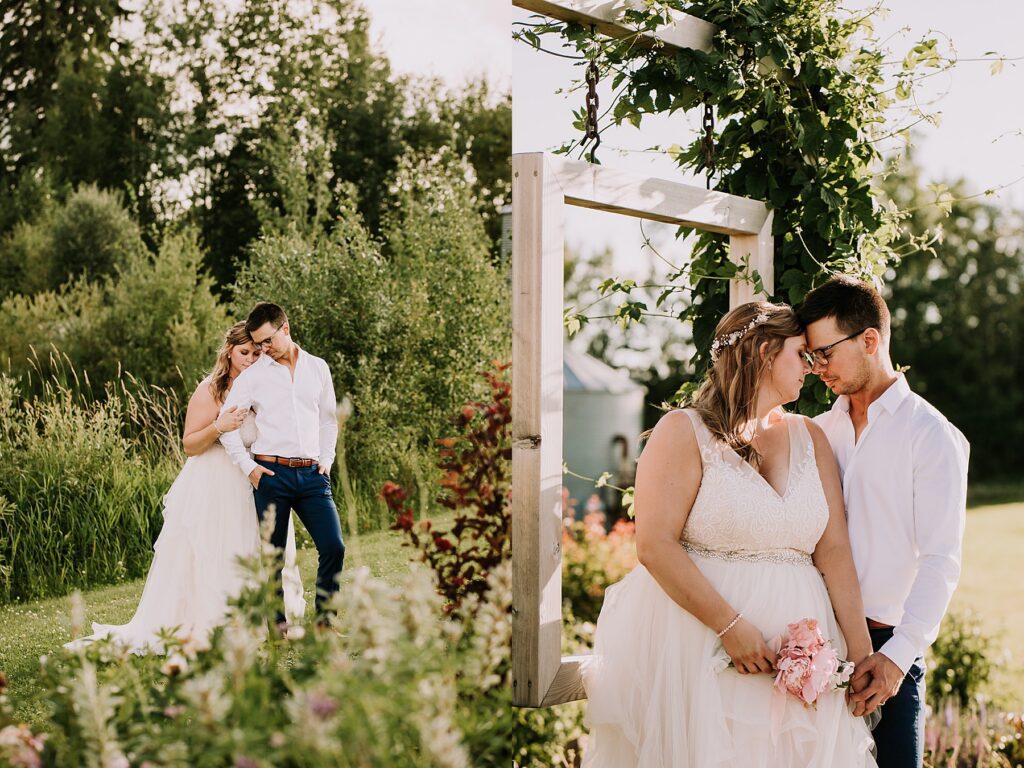 bride and groom standing in nature and snuggling close while posing for wedding photos.